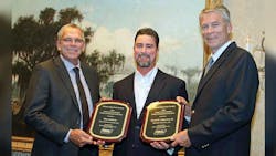Alan Roberts left Wynne Transport Service Inc safety director accepts a plaque naming him Tank Truck Safety Professional of the Year for fleets under 15 million miles and David Edgerton right receives a plaque honoring him as Tank Truck Safety Professional of the Year for fleets above 15 million miles The awards were sponsored by Heil Trailer International and were presented by Troy Hradsky with Heil Trailer International Alan Roberts left Wynne Transport Service Inc safety director accepts a plaque naming him Tank Truck Safety Professional of the Year for fleets under 15 million miles and David Edgerton right receives a plaque honoring him as Tank Truck Safety Professional of the Year for fleets above 15 million miles The awards were sponsored by Heil Trailer International and were presented by Troy Hradsky with Heil Trailer International