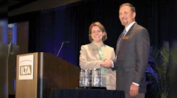 Melinda Whitney, ILTA president, congratulates Tim Aydt, Marathon Petroleum Co, on receiving the Platinum Safety Award for large company.