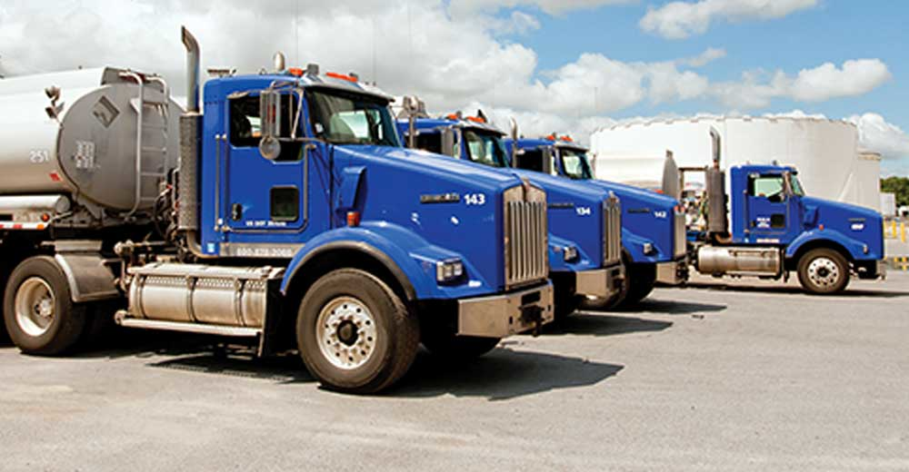 Lineup of tank trucks on lot