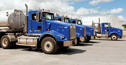 Lineup of tank trucks on lot Lineup of tank trucks on lot