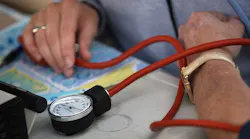 Closeup of nurse taking blood pressure