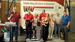 Bruce Cornelius with Werts Welding presented a plaque from company employees recognizing the Werts family for their community involvement and outreach. Werts family members on hand for the presentation included Dwight and Cheryl, Nick and Brittany with Natalie and Hunter, Karen and Jerry Hulvey, and Jake McCormick.
