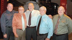 Dave Reuter center Polar Corp stands with some of his customers more Dave Reuter center Polar Corp stands with some of his customers more