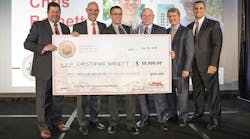 Ryder&rsquo;s 2018 Top Tech winner Christopher Barnett holds his $50,000 check alongside Ryder Senior Service Manager Josh Ison, President of Global Fleet Management Solutions Dennis Cooke, Vice President of Maintenance &amp; Engineering/Top Tech Chair Bill Dawson, Senior Vice President &amp; Global Chief of Operations Tom Havens and Chairman &amp; CEO Robert Sanchez.