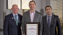 Federal-Mogul Motorparts&apos; Brent Berman, center, recently was honored with the 2018 Mort Schwartz Excellence in Education Award.