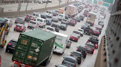 Freeway congestion from overhead taillights commercial truck in foreground