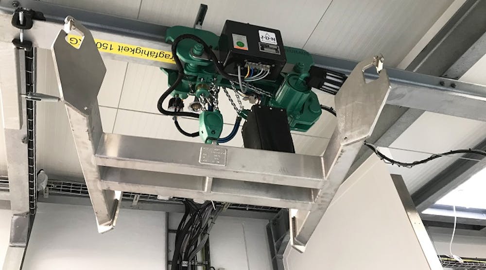 A JD Neuhaus hoist in low headroom trolley shown with radio remote control.