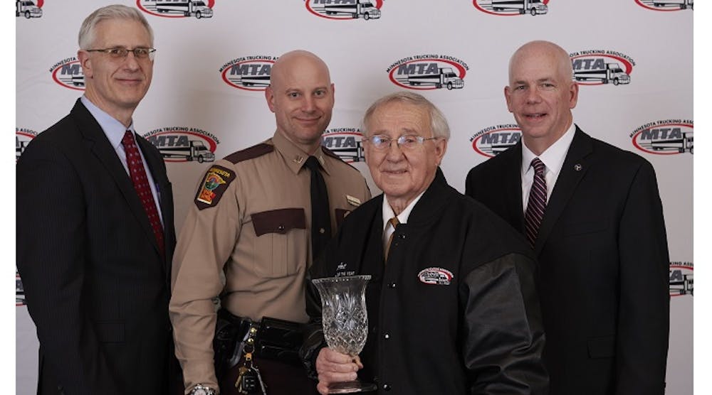 From left to right, John Hausladen, MTA president, and Capt. Jon Olsen of the Minnesota State Patrol stand with Minnesota Driver of the Year Art Stoen, a Kane Transport driver, and FMCSA&rsquo;s Matt Marrin.