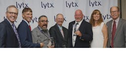 Lytx&rsquo;s Brandon Nixon, chairman and CEO, at left, and Del Lisk, vice president of safety services, flank the winners of Lytx&rsquo;s driver and coach awards, including, from left to right, Earl Brown of Performance Food Group, Leonard Leanos of Waste Management San Gabriel, Jerry Ingram of Murphy-Hoffman, Doug Hager of American Central Transport and Dina Dixon of ARS/Rescue Rooter (Coach of the Year).