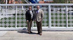 Incoming NTTC chairman Bernard Gorski, left, and retiring chairman John Whittington stand in front of the &apos;Big Rig Jig&apos; sculpture in downtown Las Vegas, Nevada.