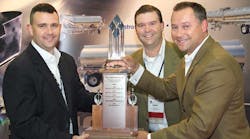 Taylor Craigen, The Jack Olsta Co, accepts the 2010 Heil Trailer International &apos;Going the Extra Mile&apos; Service Award from Greg Heyer and Greg Hewitt with Heil Trailer International. The award was presented at the National Tank Truck Carriers 2010 Cargo Tank Maintenance Seminar &amp; Equipment Show in Louisville KY.
