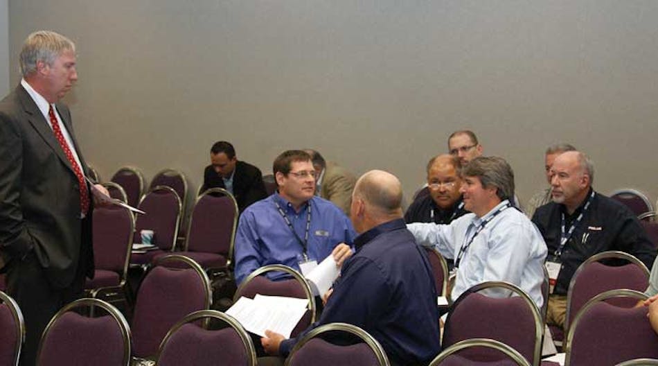 Ken Shafer discusses tank corrosion issues with a small group of attendees during the National Tank Truck Carriers 2012 Tank Truck Show &amp; Maintenance Seminar October 22-24 in Louisville, Kentucky.