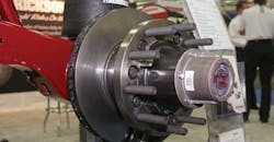 An air disc brake on a Hendrickson trailer axle with air suspension An air disc brake on a Hendrickson trailer axle with air suspension