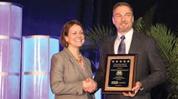 Tim Aydt, Marathon Petroleum Company, accepts the ILTA Safety Milestone Award from ILTA President Melinda Whitney.