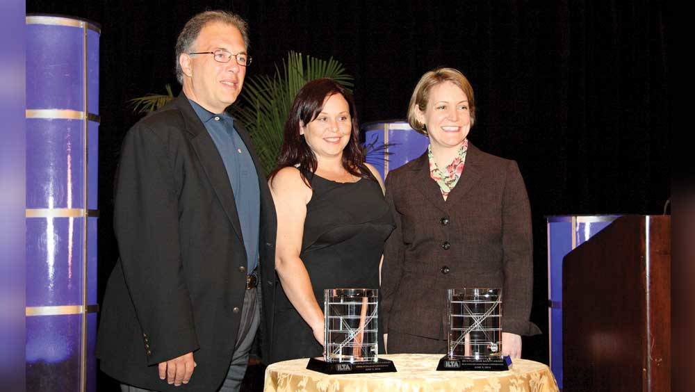 Frank Marrocco and Jessica Sisto Blackwater Midstream Corp accept the small terminal Platinum Award from Melinda Whitney