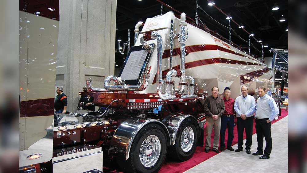 First Class Services presidentCEO Randy Stroup and driver Joe Greenwell helped show off the new PneuMACvac selfloader with Michael A Conny MAC Trailer founder and Joe Maiorana executive vicepresident of MAC Trailer