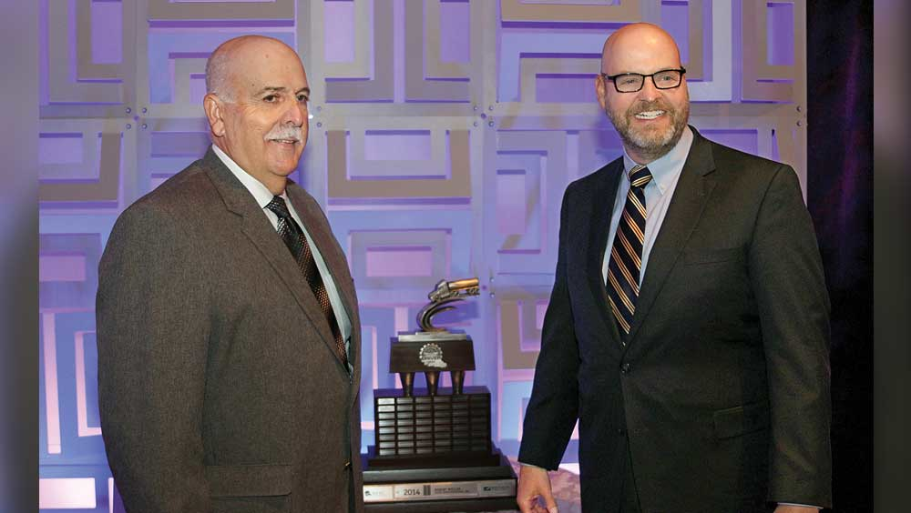 Robert Weller left Hahn Transportation Inc accepts the Professional Tank Truck Driver of the Year Trophy from Jeff Silvey Baldwin amp Lyons Inc sponsor of the trophy