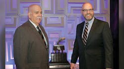 Robert Weller [left], Hahn Transportation Inc, accepts the Professional Tank Truck Driver of the Year Trophy from Jeff Silvey, Baldwin &amp; Lyons Inc, sponsor of the trophy.