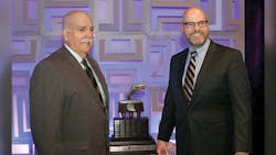 Robert Weller left Hahn Transportation Inc accepts the Professional Tank Truck Driver of the Year Trophy from Jeff Silvey Baldwin amp Lyons Inc sponsor of the trophy Robert Weller left Hahn Transportation Inc accepts the Professional Tank Truck Driver of the Year Trophy from Jeff Silvey Baldwin amp Lyons Inc sponsor of the trophy