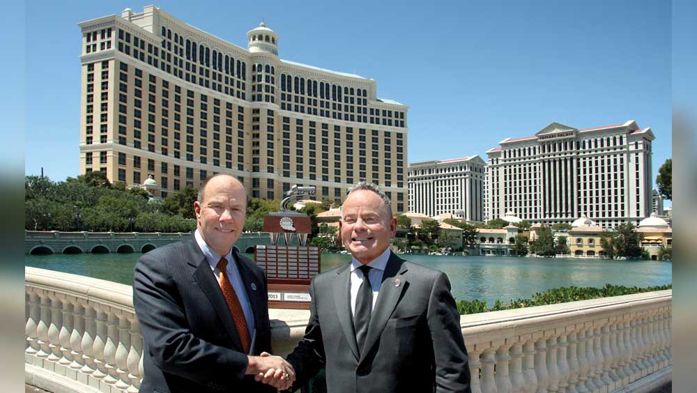 Jim Shaeffer NTTC immediate past chairman and Dean Kaplan NTTC chairman stand in front of the Bellagio with the traveling trophy that is part of the newly launched NTTC Professional Tank Truck Driver of the Year program