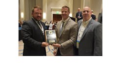 Brent Yeagy (left), president and CEO of Wabash National, recently accepted a 2018 Plant Safety Award from TTMA for its Mexico operation.