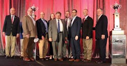 Groendyke Transport&rsquo;s leadership team gathered on the stage to accept the carrier&rsquo;s eight Heil Outstanding Safety Performance Trophy. On the left is Randy Arlt, Entrans and on the far right is Dan Furth, NTTC.