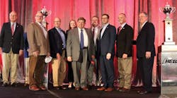 Groendyke Transport&rsquo;s leadership team gathered on the stage to accept the carrier&rsquo;s eight Heil Outstanding Safety Performance Trophy. On the left is Randy Arlt, Entrans and on the far right is Dan Furth, NTTC.