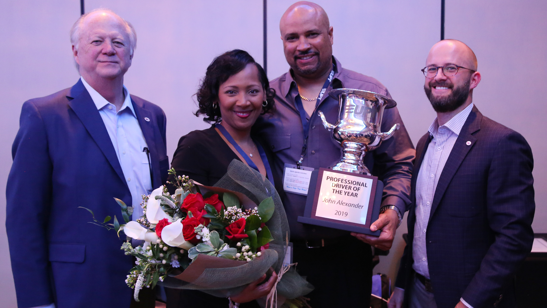 United Petroleum Transports Professional Driver of the Year John Alexander, second from right, is joined by his wife, Shonikay Alexander, UPT President and CEO Greg Price, left, and Chief Operating Officer David Price.
