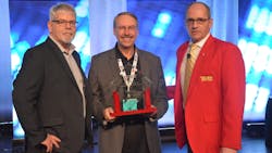 Jim Park, at left, chairman of the Technical Achievement Award committee, and Kenneth Calhoun, at right, general chairman of TMC, present Stephen Fox, vice president of business development at Stoneridege, with the Jim Winsor Memorial Technical Achievement Award. Jim Park, at left, chairman of the Technical Achievement Award committee, and Kenneth Calhoun, at right, general chairman of TMC, present Stephen Fox, vice president of business development at Stoneridege, with the Jim Winsor Memorial Technical Achievement Award.