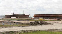 New crude oil storage tanks under construction at a pipeline terminal facility south of Houston TX. New crude oil storage tanks under construction at a pipeline terminal facility south of Houston TX.