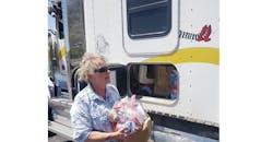 Volunteer Handing Out Ppe Kits Volunteer Handing Out Ppe Kits
