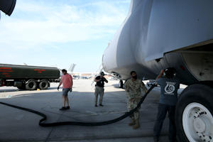 Airman First Class Deshawn Carino, 78th Logistics Readiness Squadron Fuels Management Flight Distribution Element distribution operator, and a team of C-5 aircraft functional test mechanics prepare a C-5 Galaxy for defueling operations at Robins Air Force Base in Georgia. One defuel truck takes about an hour to remove fuel from an aircraft and return the fuel to bulk storage.