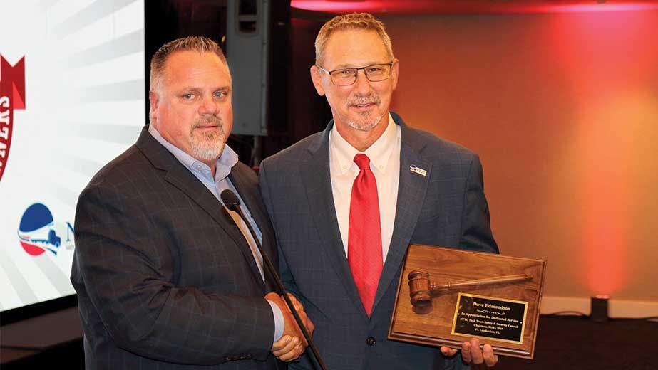 Heniff Transportation&apos;s Terry Kolacki, at left, presents Dave Edmondson with an award. Kolacki will be honored for his contributions as Safety and Security Council chairman during Tank Truck Week.