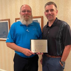 Eagle Transport president Lance Collette, at right, congratulates Ronnie McCoy for his 2020 NCTA Safety Professional of the Year award.