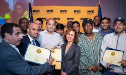 Meer Joshi, center, joins some of the safest livery drivers in New York City during the city&apos;s Taxi and Limousine Commission&apos;s 2018 Vision Zero Safety Honor Roll ceremony.