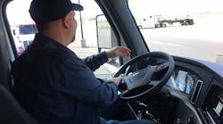 A driver, under the age of 21, is trained to drive heavy-duty trucks in California. A pilot program that is part of the pending infrastructure bill would allow some younger drivers to participate in interstate commerce, which currently is against federal trucking guidelines.