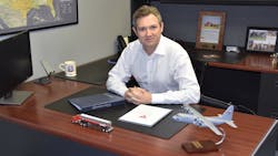 This C-130 on Ryan Usher’s desk is a miniature version of the aircraft he pilots for the Air Force. This C-130 on Ryan Usher’s desk is a miniature version of the aircraft he pilots for the Air Force.