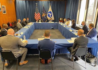 Officials gather for a registered apprenticeship program signing ceremony at U.S. Labor Department headquarters in Washington D.C.