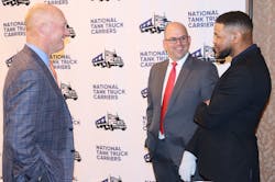 Recent past chairman Rob Sandlin, at left, and NTTC president and CEO Ryan Streblow, center, visit with motivational speaker Inky Johnson after his keynote address at NTTC&apos;s 2022 Annual Conference in San Diego, Calif.