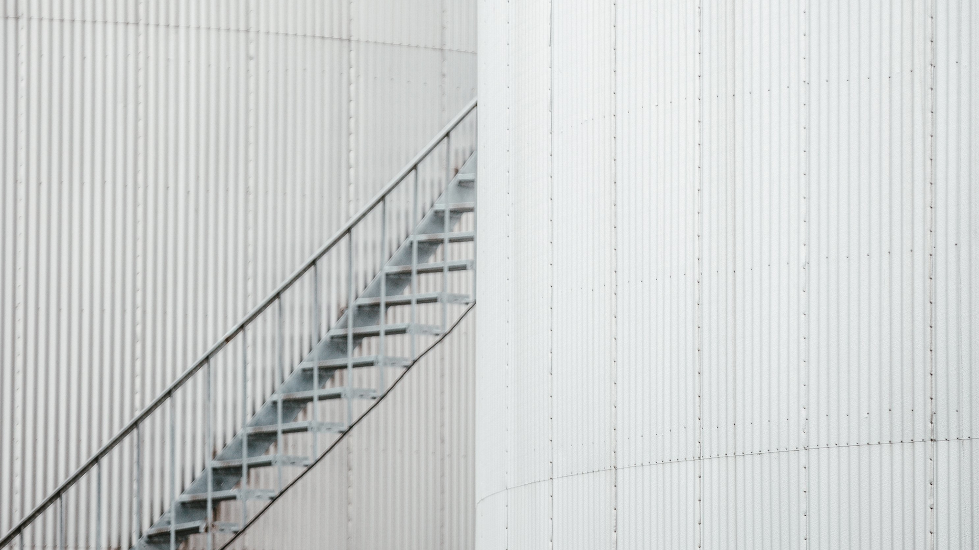 Negative Space Grey Iron Staircase Between Two Buildings 62991d1031a5c