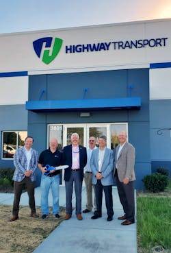 Highway Transport president and CFO Marshall Franklin, at left, and his team recently celebrated the opening of a new Chicago-area service center in Channahon, Ill.