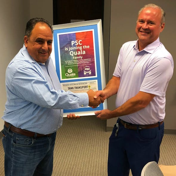 Jerry Cignarella, at left, PSC president and now Quala&apos;s president of maintenance, shakes hands with Paul Hofley, vice president of sales and marketing at Quala, during a recent board meeting.