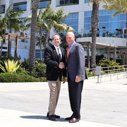 NTTC&apos;s 2021-22 chairman of the board Rob Sandlin, president and CEO of Florida Rock &amp; Tank Lines, at right, shakes hands with 2022-23 chairman Randy Clifford, chairman and CEO of Ventura Transfer Company, during NTTC&apos;s 2022 Annual Conference in San Diego, California.