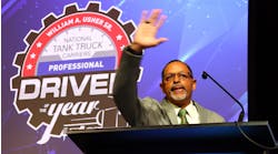 Hoffman Transportation driver Kenneth Tolliver waves to the crowd after earning the title of NTTC&apos;s 2022-23 Professional Tank Truck Driver of the Year on May 22 in Everett, Massachusetts.