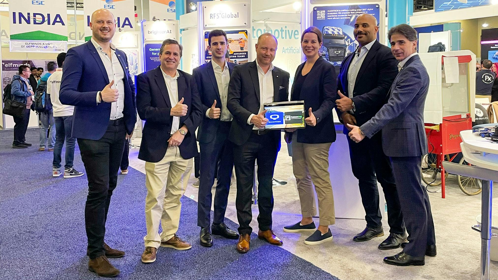 Quantron and FusionOne representatives at CES, from left to right: Martin Lischka (director marketing, brand and strategy, Quantron AG), Richard Ansell (VP marketing/PR, Quantron US), Christos Zorbas (analyst, FusionOne), Andreas Haller (CEO and founder, Quantron AG), Damaris Meyer (CFO, Quantron US), Matthew Emory (EVP of South East Region USA, FusionOne), John Zorbas (chairman of the board of directors, FusionOne).