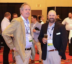 NTTC chairman Herb Evans enjoys a laugh with Jeremy Mairs, Cox Petroleum president and CEO, during the 2023 Annual Conference in Boston.