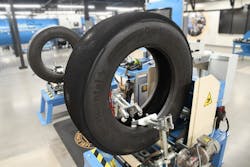 A tire awaits meticulous attention inside Continental&apos;s news Retread Solutions Development Center in Rock Hill, South Carolina.