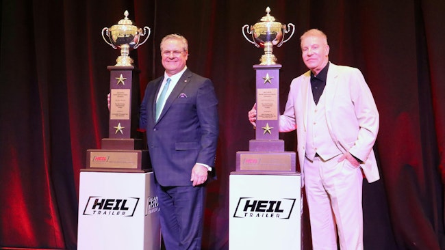 Groendyke CEO Greg Hodgen, at left, and G&D Trucking/Hoffman Transportation president and CEO Kevin Hoffman stand with their 2023 North American safety championships.