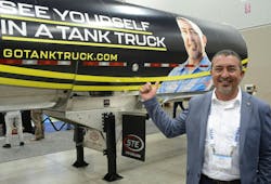 Dave Powell stands with the NTTC branding campaign trailer wrap bearing his image during NTTC's Tank Truck Week 2023. Dave Powell stands with the NTTC branding campaign trailer wrap bearing his image during NTTC's Tank Truck Week 2023.