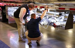Attendees inspected every inch of the many tank trailers on display. Attendees inspected every inch of the many tank trailers on display.